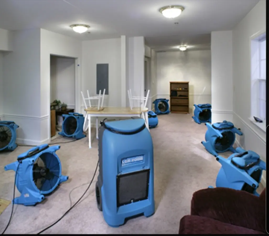 Air movers and dehumidifier setup for Water Damage Restoration in Maplewood